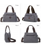 Bolso de Hombro de Lona Gris con Correas Contrastantes y Diseño Práctico