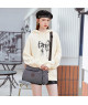Bolso de Hombro de Lona Gris con Correas Contrastantes y Diseño Práctico